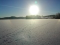 sun over the frozen lake